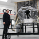 Astrobotic systems engineer Ander Solorzano stands beside a test model of the company’s Peregrine lunar lander currently in development. It’s set to be the first American lander on the Moon since the Apollo missions.